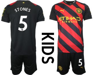 Kinder Manchester City Auswärtstrikot 2022-23 schwarz rot mit Aufdruck STONES 5